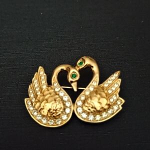 Elegant Gold Swan Brooch with Crystal Accents